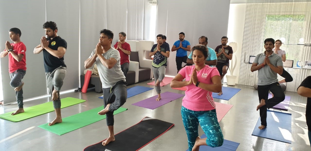 Summertown Employees doing Yoga Pose