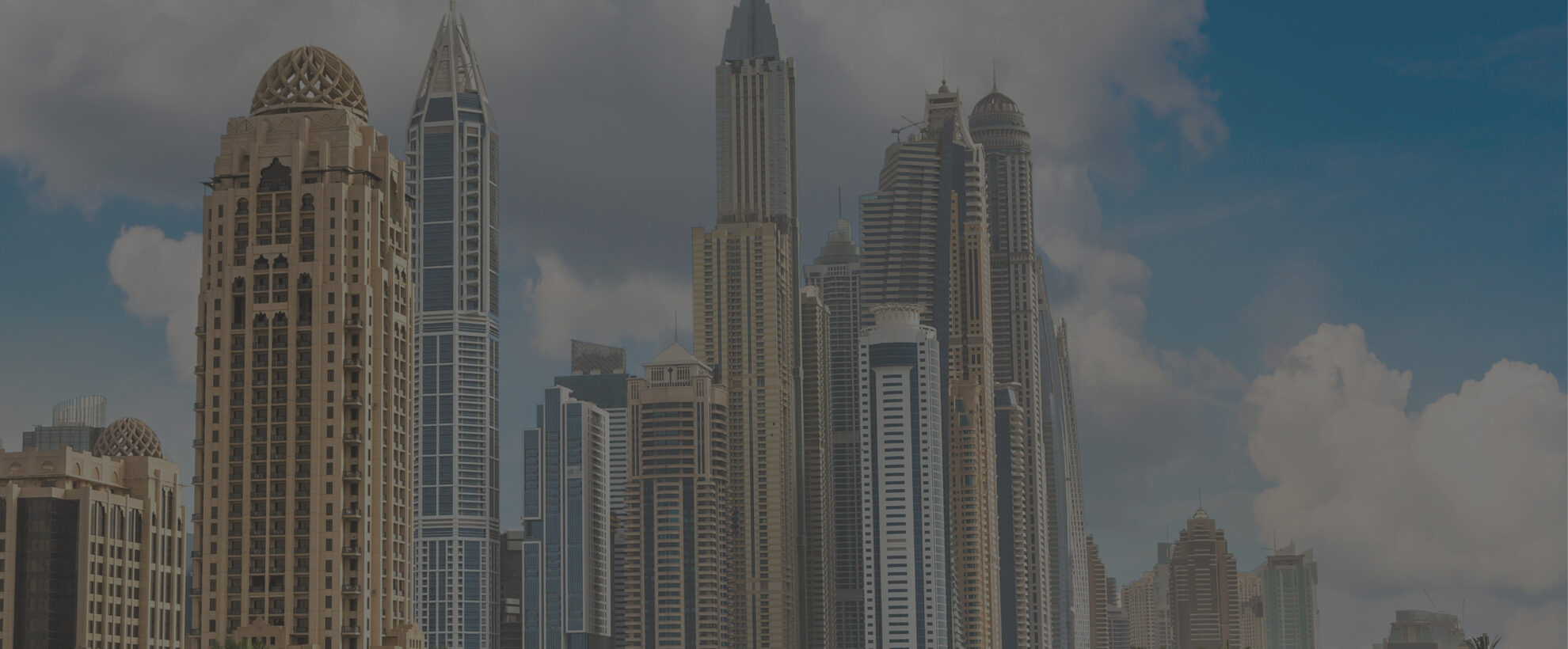 Summertown and Emirates Green Building Council partnership announcement with Dubai Marina skyline in the background, symbolising sustainable progress in the UAE’s built environment.