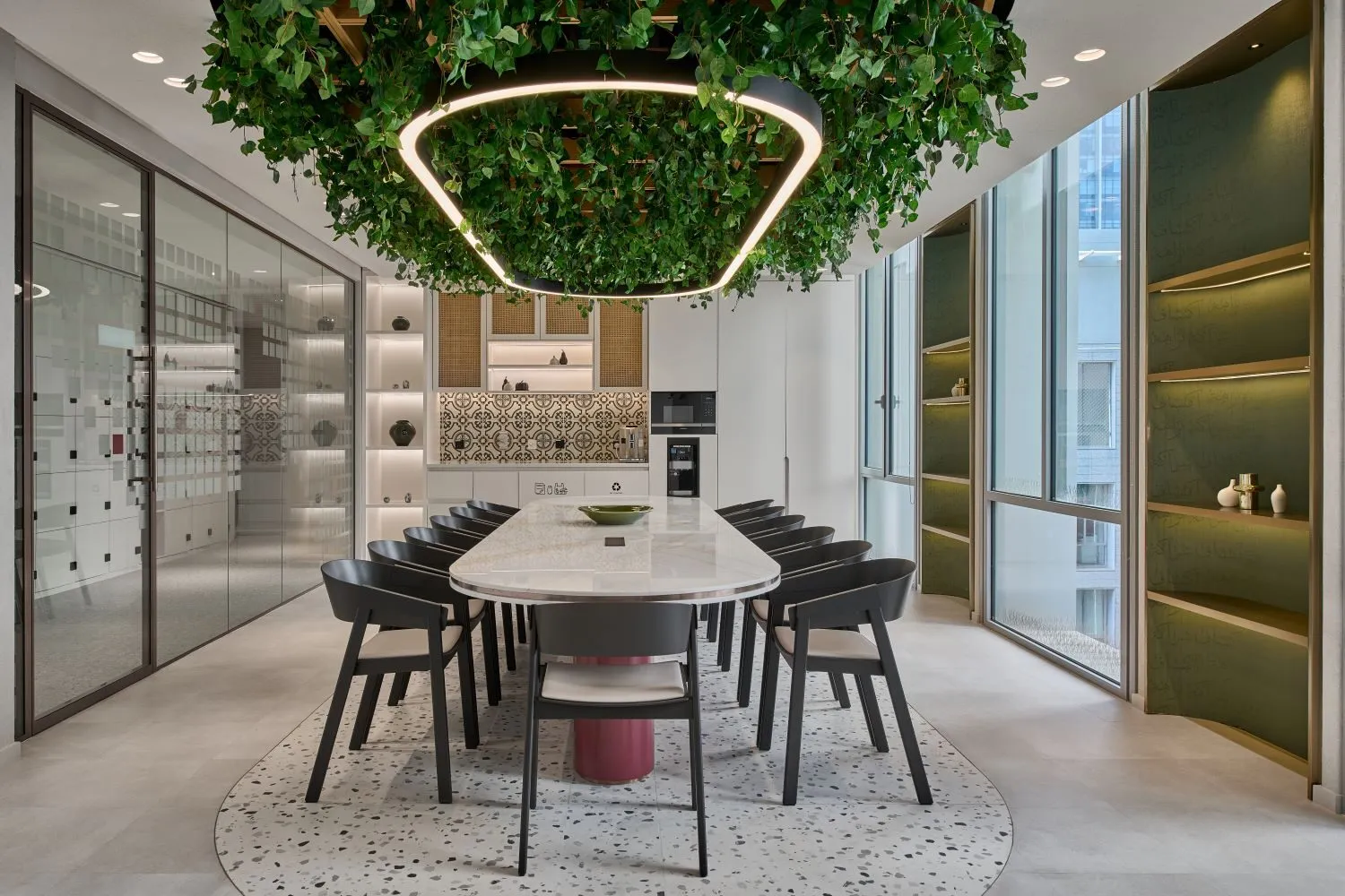 Biophilic office fit-out with a meeting table and green, plant-covered roof