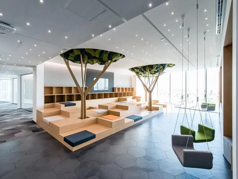 Bright, modern Dubai office with natural light, soft colour tones, and ergonomic design - showcasing how employee wellness supports sustainable business success.