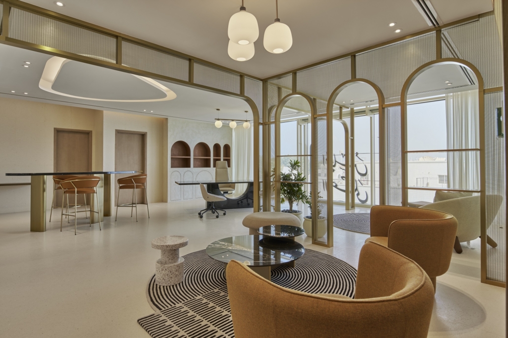 Contemporary office lounge by Summertown Interiors for the Supreme Council for Motherhood & Childhood, featuring sustainable fit-out, ergonomic furniture, biophilic design, and natural light to enhance wellbeing.