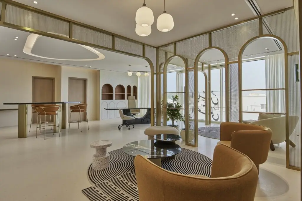 Contemporary office lounge by Summertown Interiors for the Supreme Council for Motherhood & Childhood, featuring sustainable fit-out, ergonomic furniture, biophilic design, and natural light to enhance wellbeing.