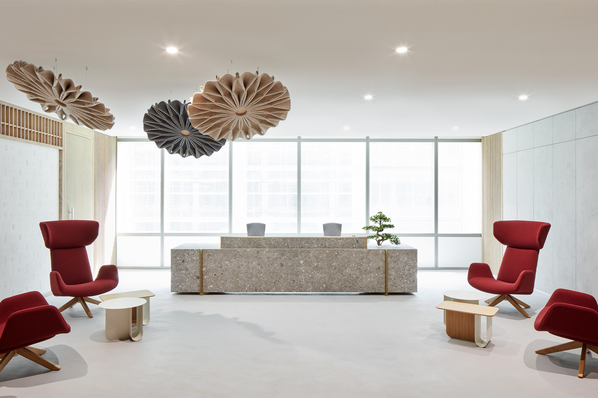 Modern conference room with green accent seating and large windows