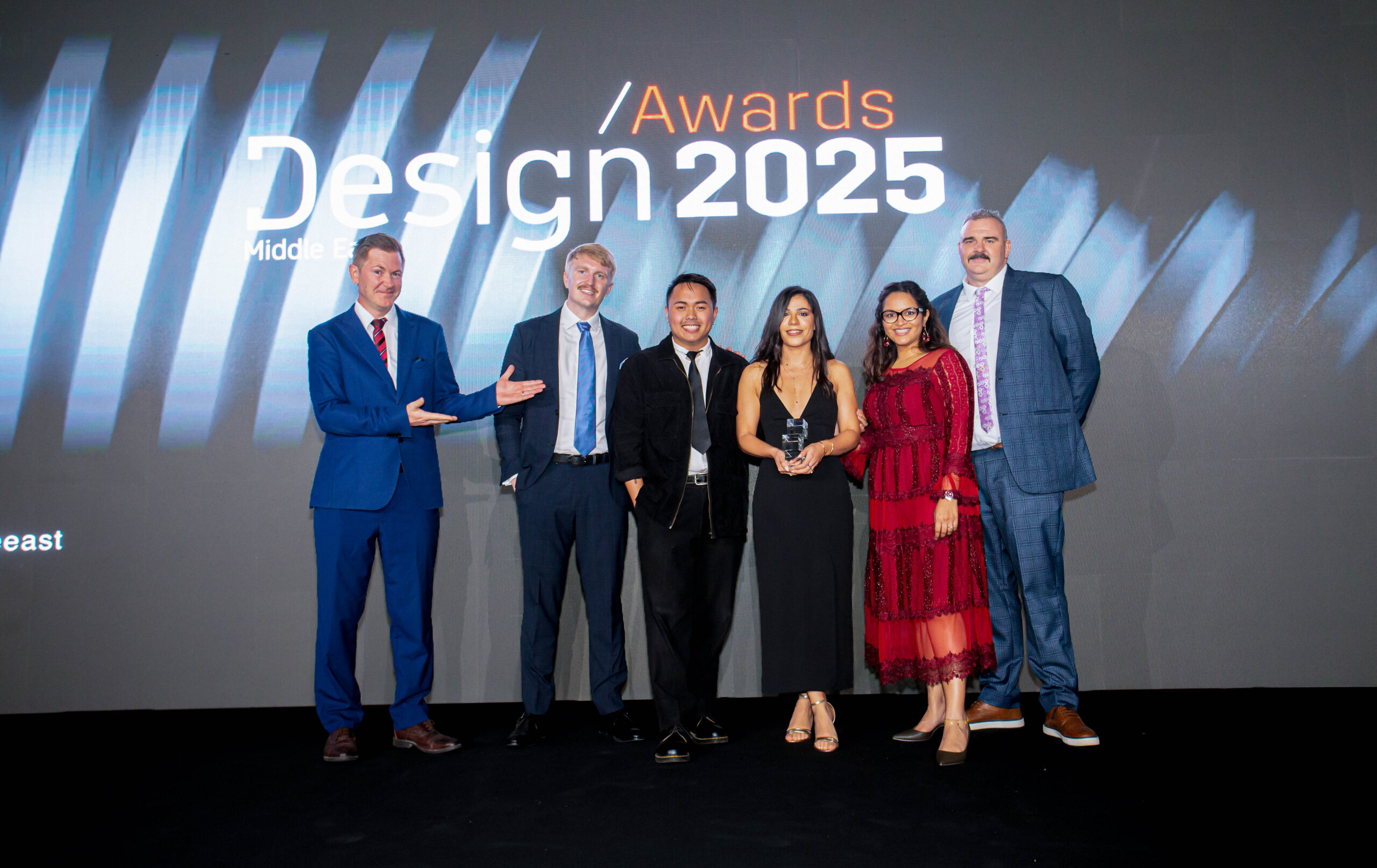 Summertown Interiors team on stage receiving the Sustainable Project of the Year award at the 2025 Design Middle East Awards in Dubai