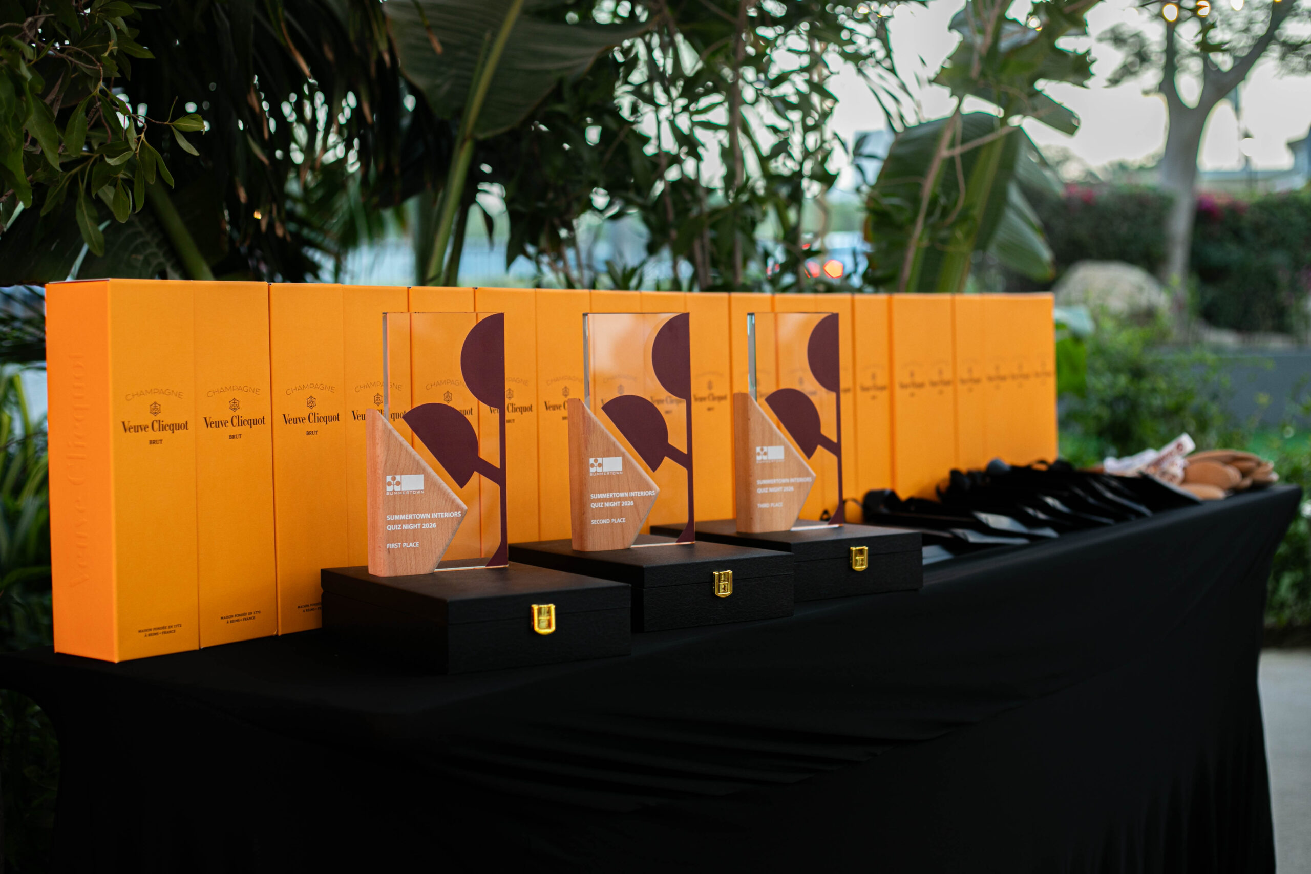Summertown Interiors Quiz Night 2026 trophies and Veuve Clicquot prizes displayed at the event in Dubai