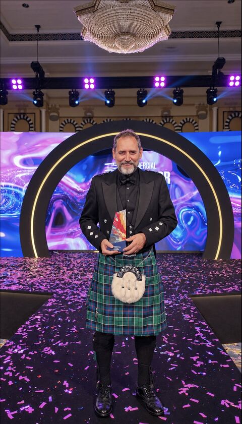 Steven Lessels of Summertown Interiors on stage with his Project Manager of the Year trophy at the CID Awards MENA 2026